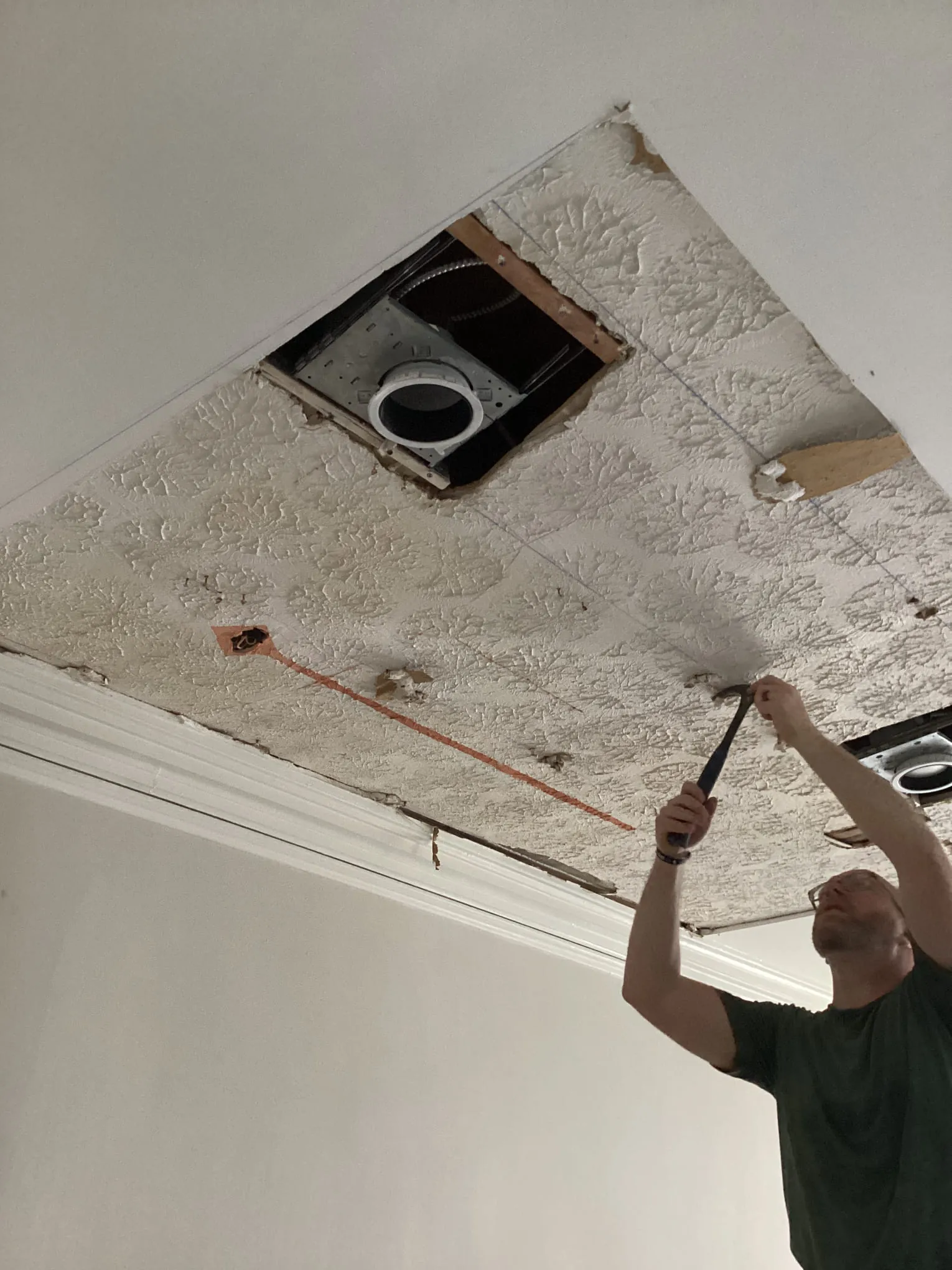 Air scrubber running against an opened wall cavity during odor work