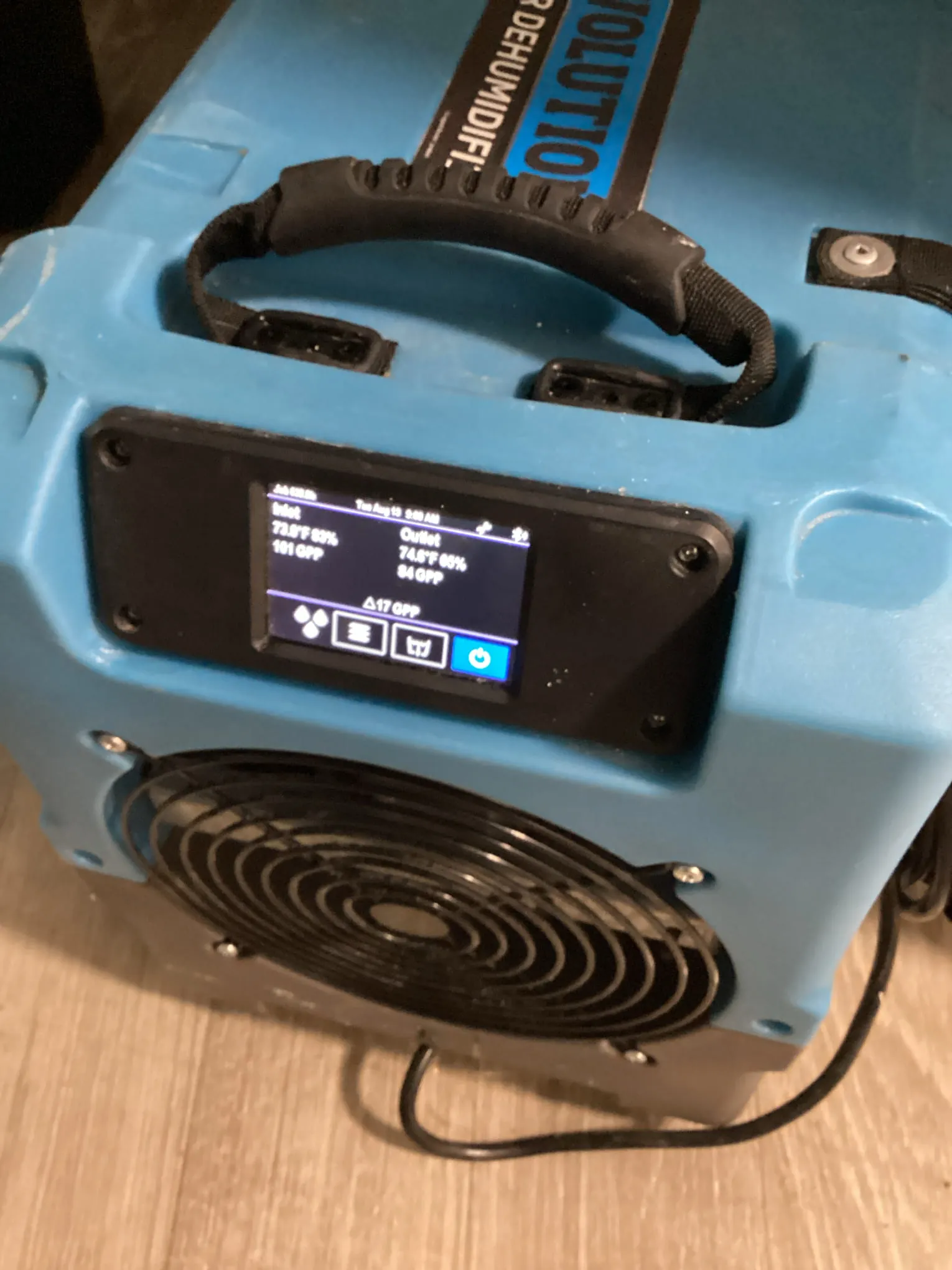 Dehumidifier control panel monitored during a drying job at a Hurstbourne property