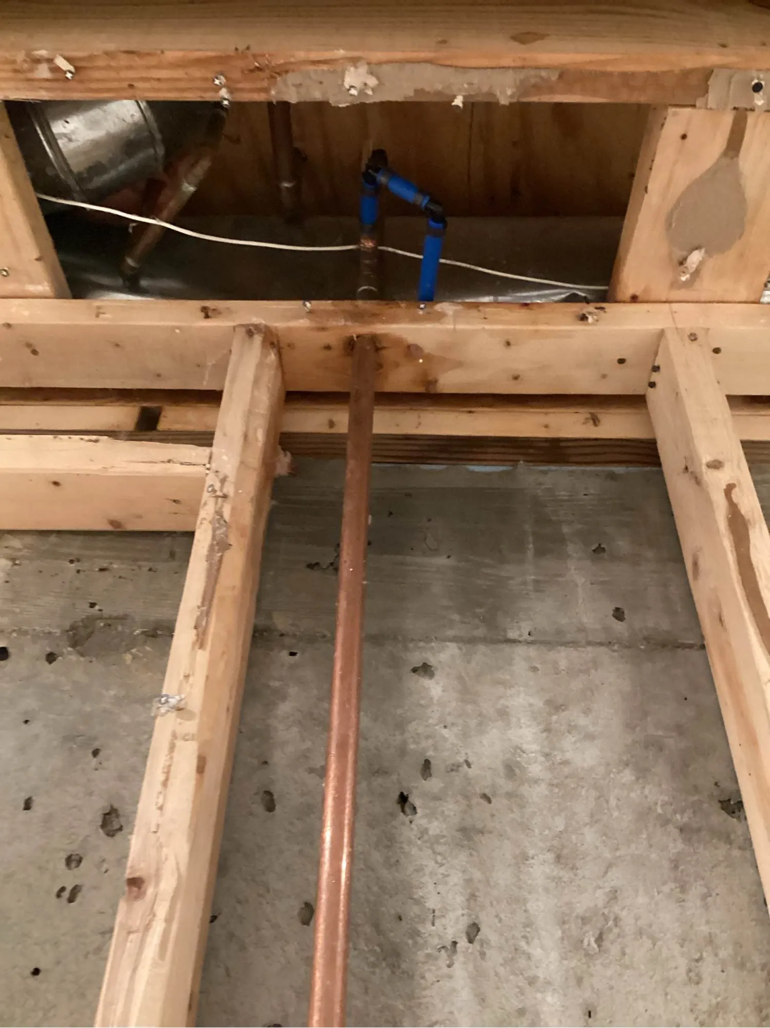Air movers running on an exposed subfloor after contaminated water was removed from a Louisville property