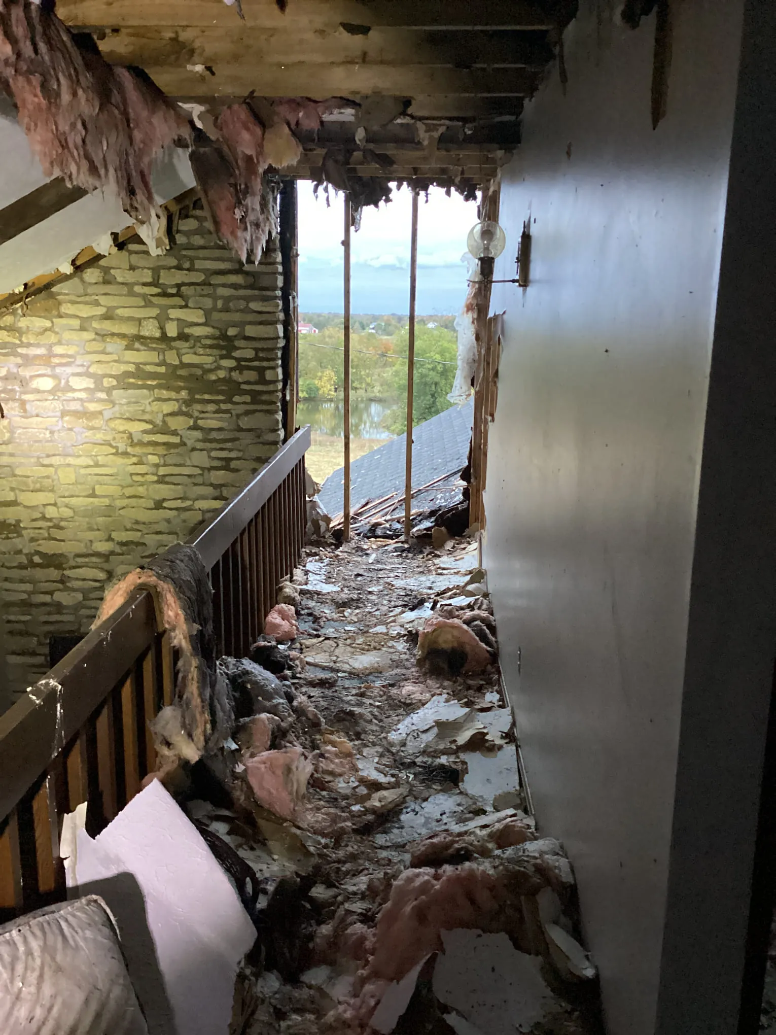 Hallway with storm damage and water intrusion in a Louisville home after severe weather