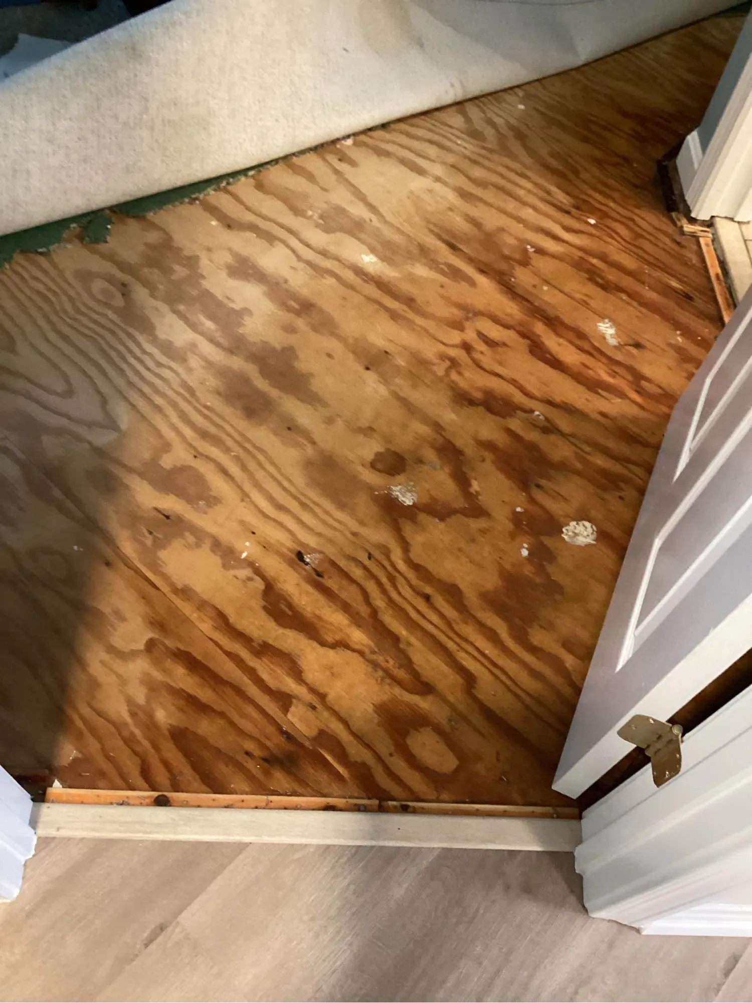 New flooring going down over a dried and prepared subfloor after water damage cleanup